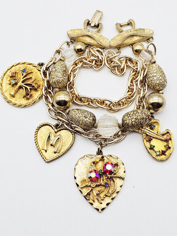 VINTAGE OLD HOLLYWOOD CHARM BRACELET WITH LARGE ORNATE CHARMS, RHINESTONES & MULTI-STRAND GOLD BEAD