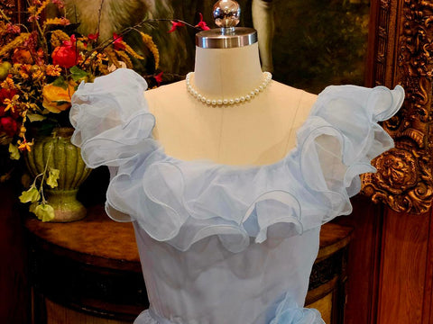 ETHEREAL 1950S BLUE ORGANZA EVENING GOWN WITH SATIN WAIST SASH AND HAND-CRAFTED ROSE DETAIL