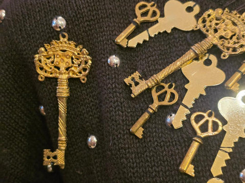 BONNIE BOERER & COMPANY 1980S BLACK RAMIE - COTTON SWEATER WITH GOLD KEY MOTIF AND SILVER STUDS