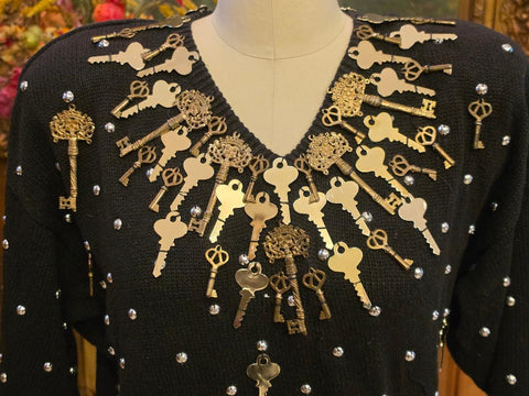 BONNIE BOERER & COMPANY 1980S BLACK RAMIE - COTTON SWEATER WITH GOLD KEY MOTIF AND SILVER STUDS