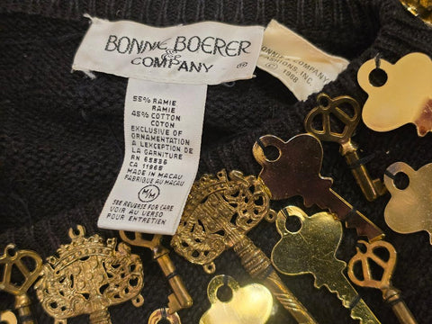 BONNIE BOERER & COMPANY 1980S BLACK RAMIE - COTTON SWEATER WITH GOLD KEY MOTIF AND SILVER STUDS