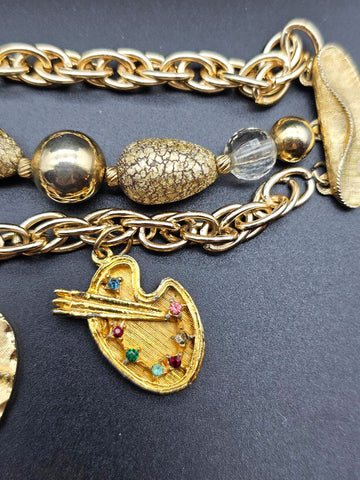 VINTAGE OLD HOLLYWOOD CHARM BRACELET WITH LARGE ORNATE CHARMS, RHINESTONES & MULTI-STRAND GOLD BEAD