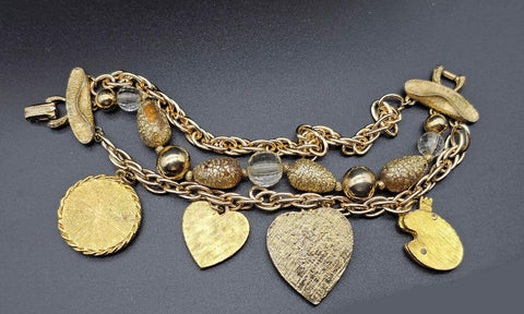 VINTAGE OLD HOLLYWOOD CHARM BRACELET WITH LARGE ORNATE CHARMS, RHINESTONES & MULTI-STRAND GOLD BEAD