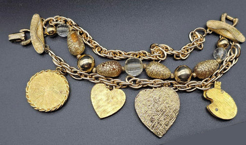 VINTAGE OLD HOLLYWOOD CHARM BRACELET WITH LARGE ORNATE CHARMS, RHINESTONES & MULTI-STRAND GOLD BEAD