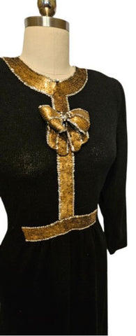 *  VINTAGE LILLIE RUBIN BLACK KNIT EVENINGS DRESS WITH HUGE GOLD AND SILVER SEQUIN BOW ACCENTED WITH SPARKLING RHINESTONES