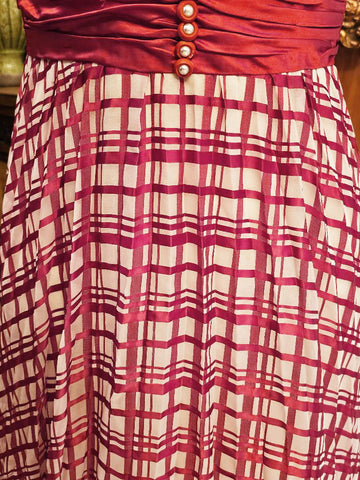 VINTAGE LATE 1960S EARLY 1970S RED AND WHITE PLAID PLEATED EVENING GOWN WITH RUCHED CUMMERBUND & PEARL BUTTONS