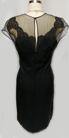 *VINTAGE "70S BLACK ILLUSION JEAN OF CALIFORNIA COCKTAIL DRESS ADORNED WITH CHANTILLY LACE