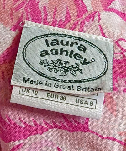 *   VINTAGE LAURA ASHLEY COTTON ROSE AND PINK FLORAL GORED GRAND SWEEP DRESS WITH HUGE BOW AND STREAMERS MADE IN GREAT BRITAIN