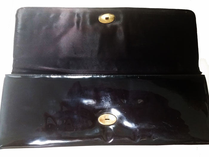 Black Envelope patent-leather clutch bag | Saint Laurent | MATCHES UK