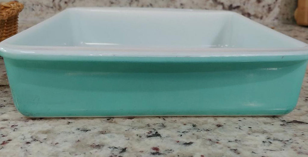 https://midnightglamour.com/cdn/shop/products/PYREX-8-INCH-TURQUOISE-12-BAKING-DISH-WITH-WICKER-BASKET-HOLDER_498f2953-d0ba-473f-8f72-8fe17ed78ab6_1024x1024.jpg?v=1607280096
